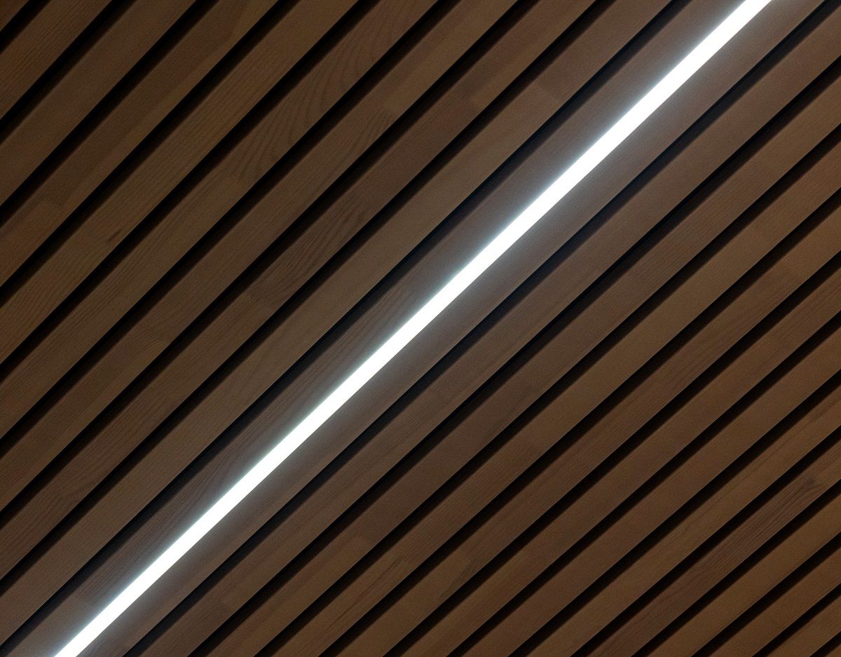 Close-up of a solution for suspended ceilings, aluminium profile and colour temperature adjustable LED strip in the groove of the ceiling slab